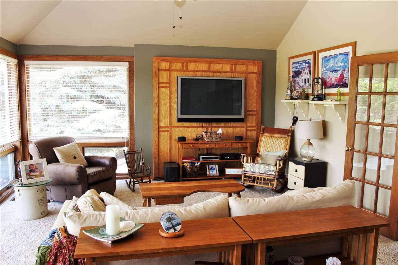 766 Timber Ridge Trail Rockford, IL 61114 - Photo 8 of 25 a living room with furniture and a flat screen tv