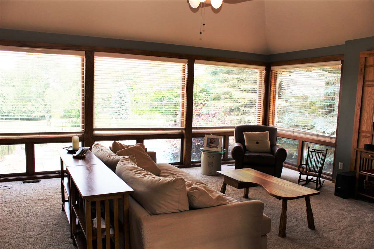 766 Timber Ridge Trail Rockford, IL 61114 - Photo 9 of 25 a living room with furniture and a floor to ceiling window