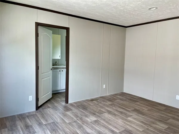 a view of a livingroom with wooden floor and closet