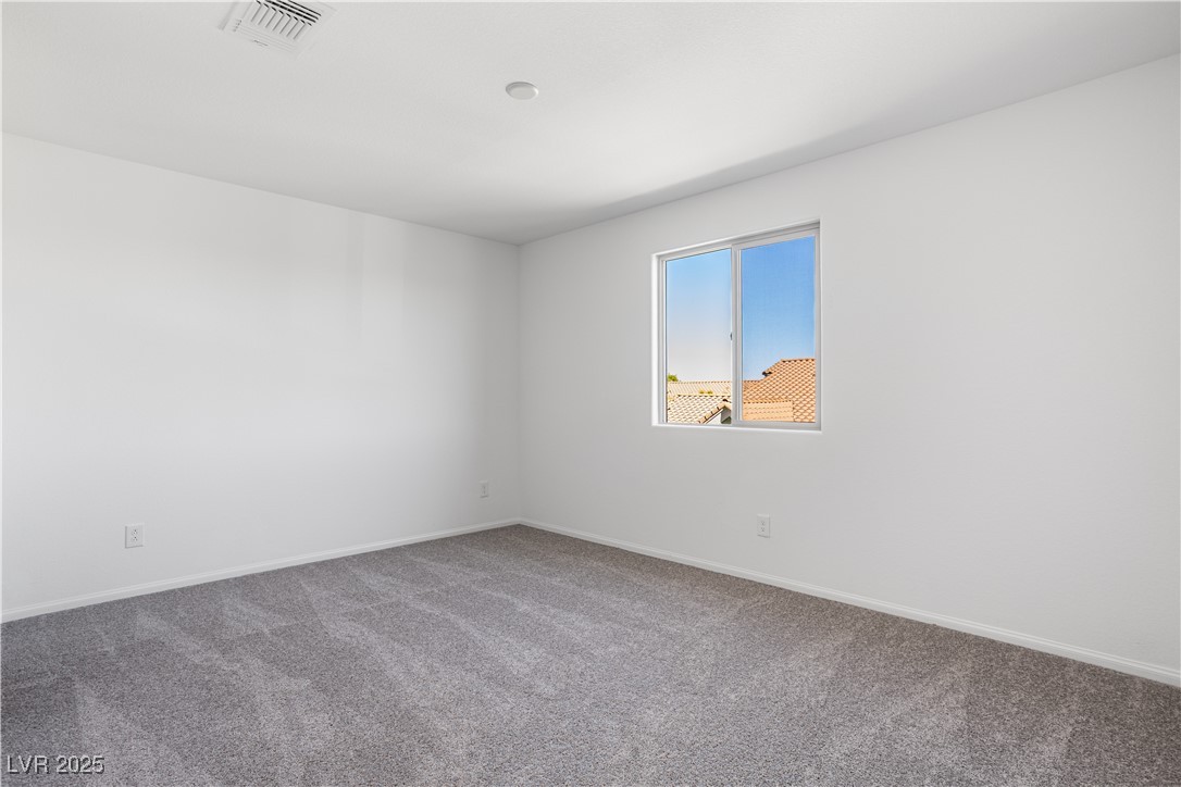 5670 Spring Trellis Street Las Vegas, NV 89113 - Photo 12 of 23 Unfurnished room featuring carpet and baseboards