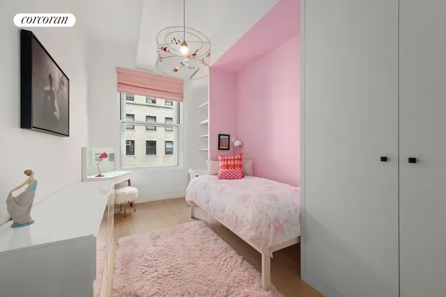 a bathroom with a sink a toilet a mirror and shower