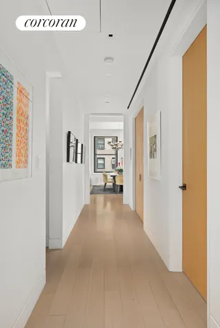 a bathroom with a toilet sink a mirror and vanity