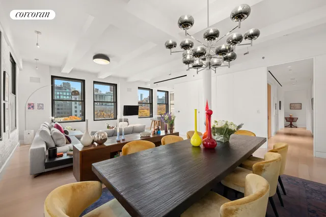 a bedroom with furniture and a chair