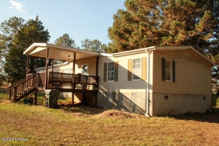 362 Chestnut Hill Road Fort Valley, GA 31030 - Photo 2 of 23 a view of a house with wooden fence