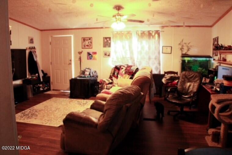 362 Chestnut Hill Road Fort Valley, GA 31030 - Photo 6 of 23 a living room with furniture a flat screen tv and a window