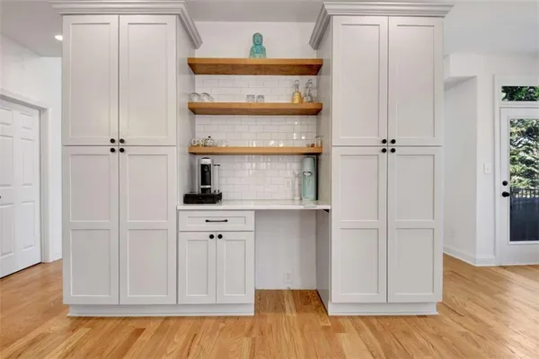 a view of cabinets and wooden floor