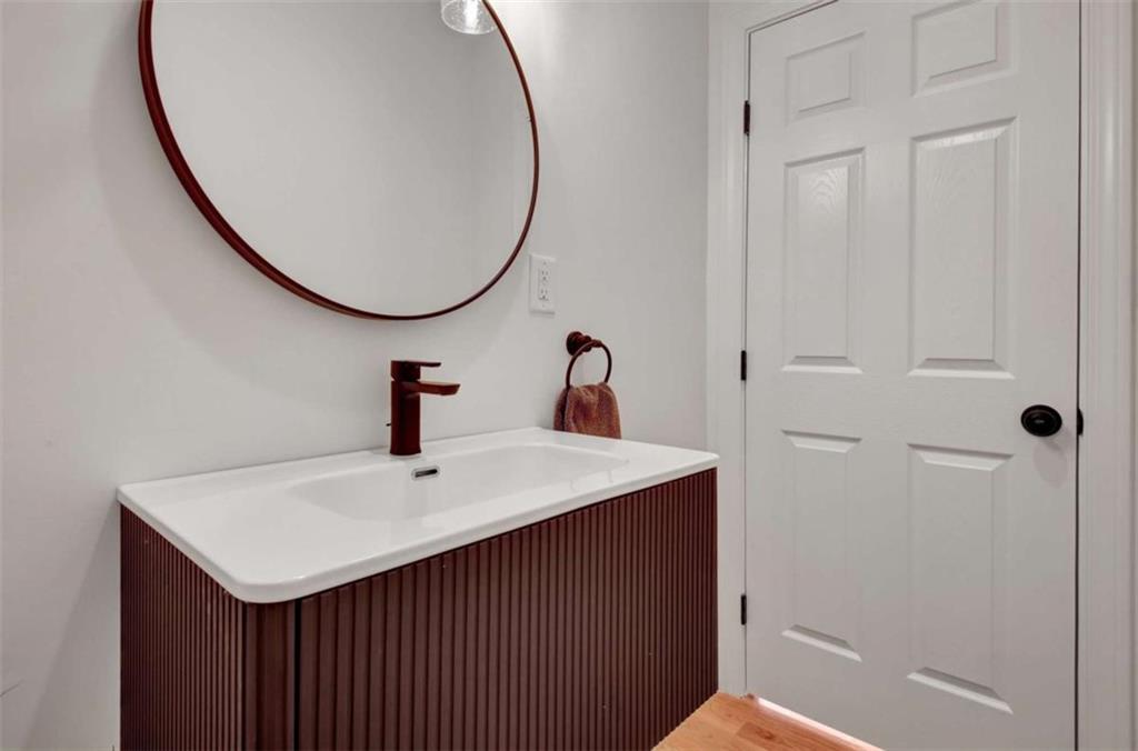 551 Lees Mill Road Fayetteville, GA 30214 - Photo 19 of 38 a bathroom with a sink and a mirror