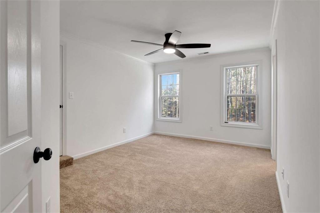 551 Lees Mill Road Fayetteville, GA 30214 - Photo 22 of 38 a view of an empty room with a window