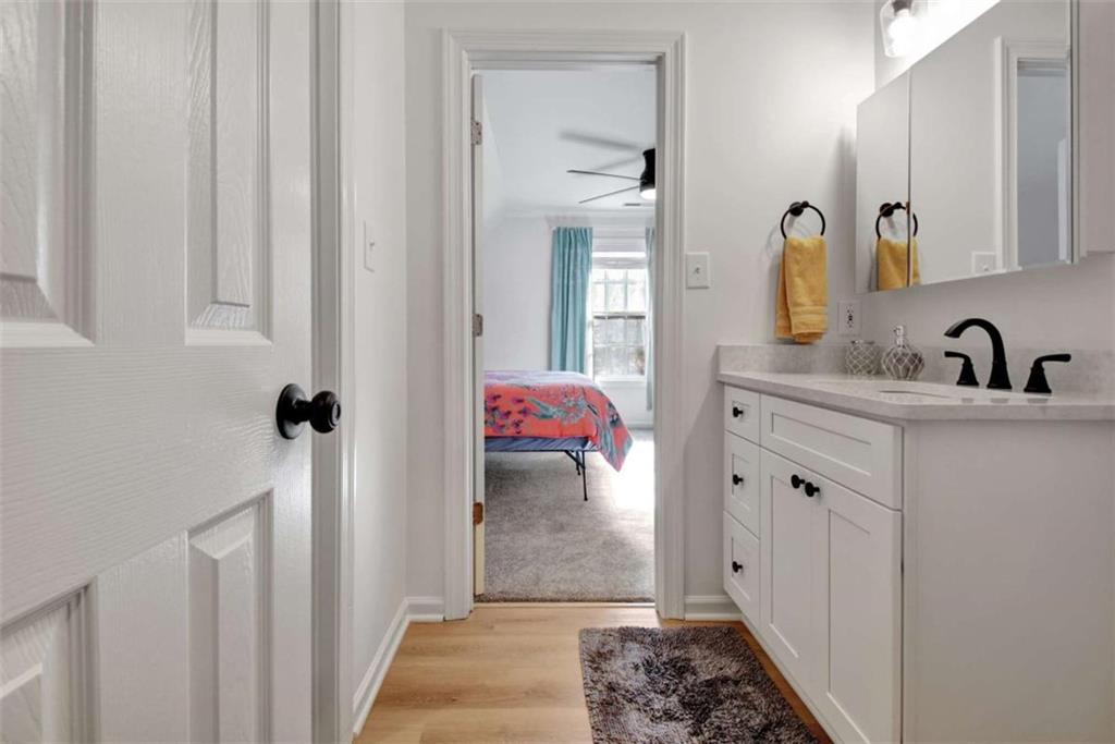 551 Lees Mill Road Fayetteville, GA 30214 - Photo 24 of 38 a bathroom with a sink and a mirror