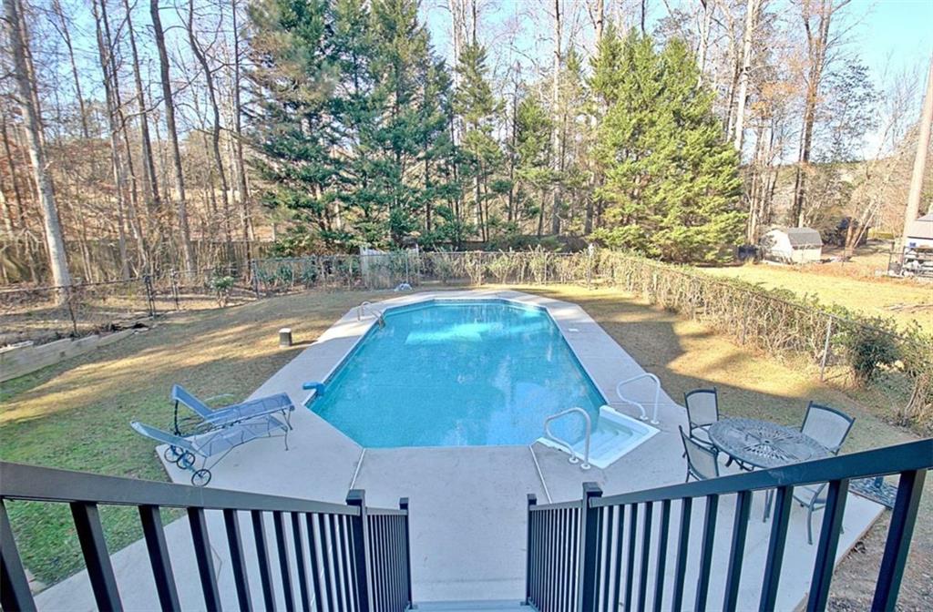 551 Lees Mill Road Fayetteville, GA 30214 - Photo 38 of 38 a view of a swimming pool with a patio and yard