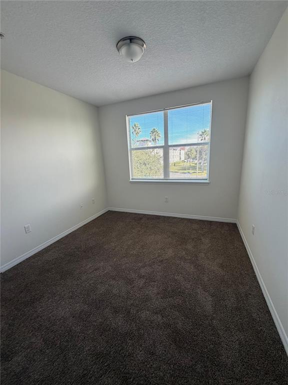 2121 McCoy Road, Unit 235 Orlando, FL 32809 - Photo 13 of 20 an empty room with windows