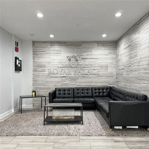 a living room with a couch and a rug