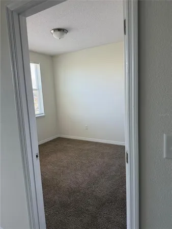 a view of a room that has a window in it