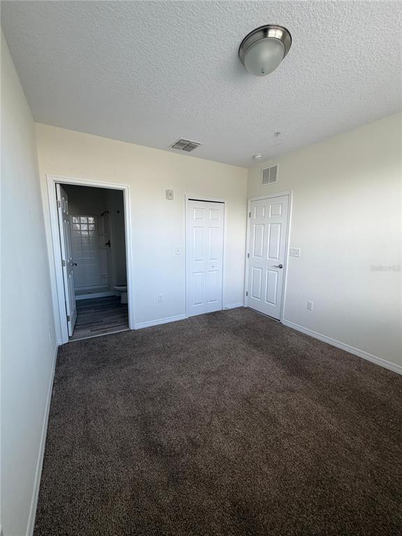 2121 McCoy Road, Unit 235 Orlando, FL 32809 - Photo 7 of 20 an empty room with windows and closet
