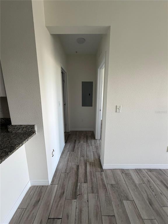 2121 McCoy Road, Unit 235 Orlando, FL 32809 - Photo 9 of 20 a view of a room with wooden floor