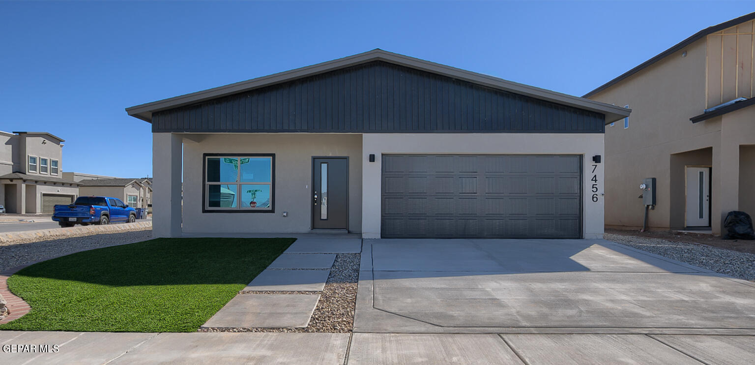 9928 Marisabel Socorro, TX 79927 - Photo 1 of 1 a front view of a house with a yard and garage