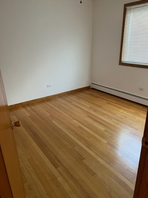 6850 Cermak Road, Unit 1B Berwyn, IL 60402 - Photo 11 of 15 a view of a room with wooden floor and windows