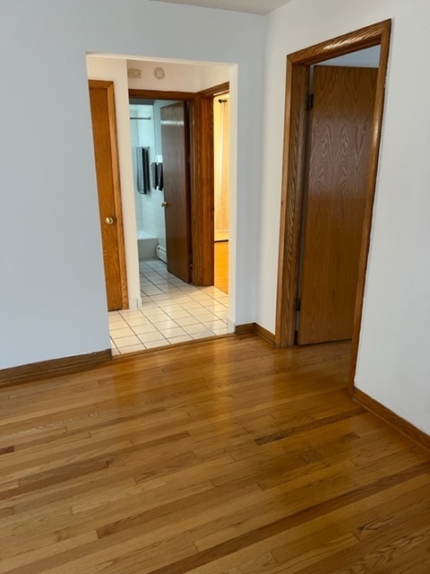 6850 Cermak Road, Unit 1B Berwyn, IL 60402 - Photo 4 of 15 a view of hallway with wooden floor