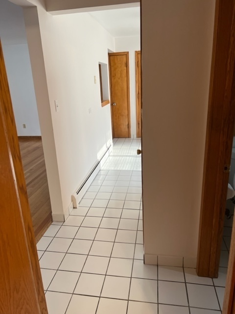 6850 Cermak Road, Unit 1B Berwyn, IL 60402 - Photo 6 of 15 a view of an empty room and wooden floor