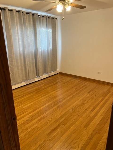 6850 Cermak Road, Unit 1B Berwyn, IL 60402 - Photo 10 of 15 a view of an empty room with a window