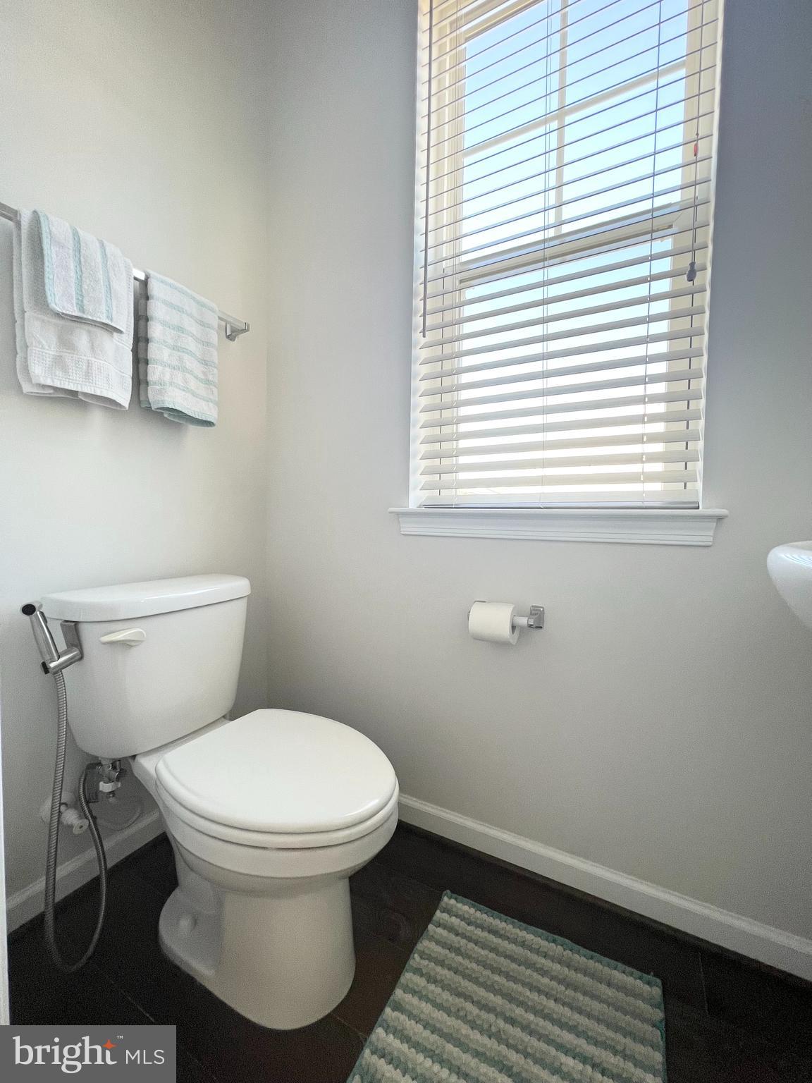 3501 Landing Way Silver Spring, MD 20906 - Photo 21 of 42 a white toilet sitting in a bathroom next to a window