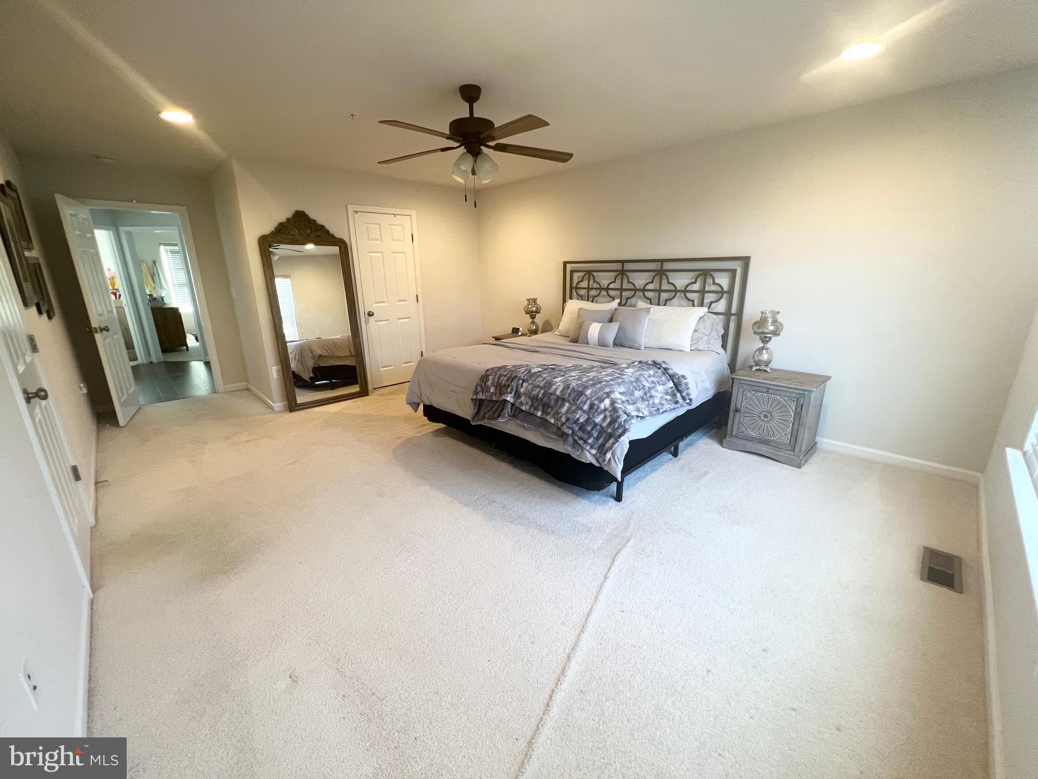 3501 Landing Way Silver Spring, MD 20906 - Photo 29 of 42 a bedroom with a bed a mirror and on the wall