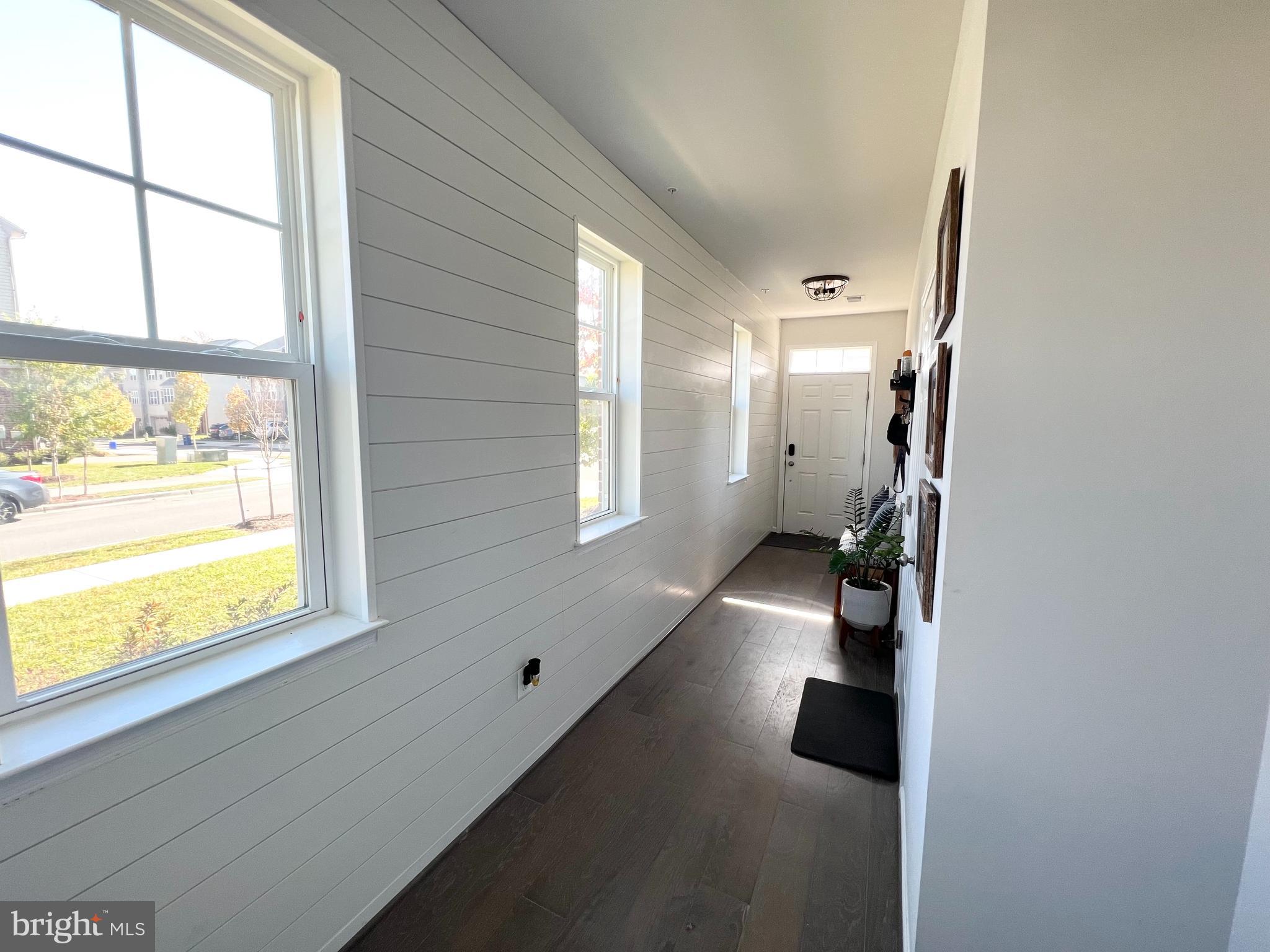 3501 Landing Way Silver Spring, MD 20906 - Photo 4 of 42 a view of hallway with windows and chandelier