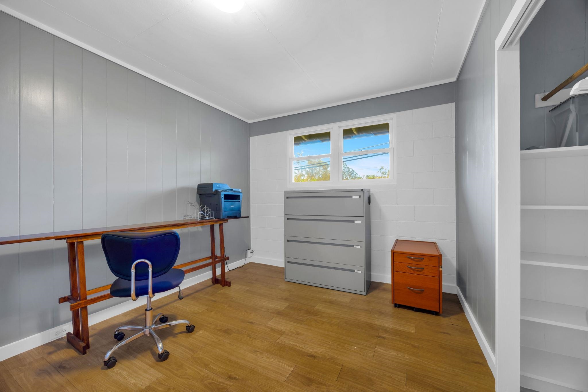 1199 Freitas Place Makawao, HI 96768 - Photo 15 of 49 a bedroom with a bed and a cabinets