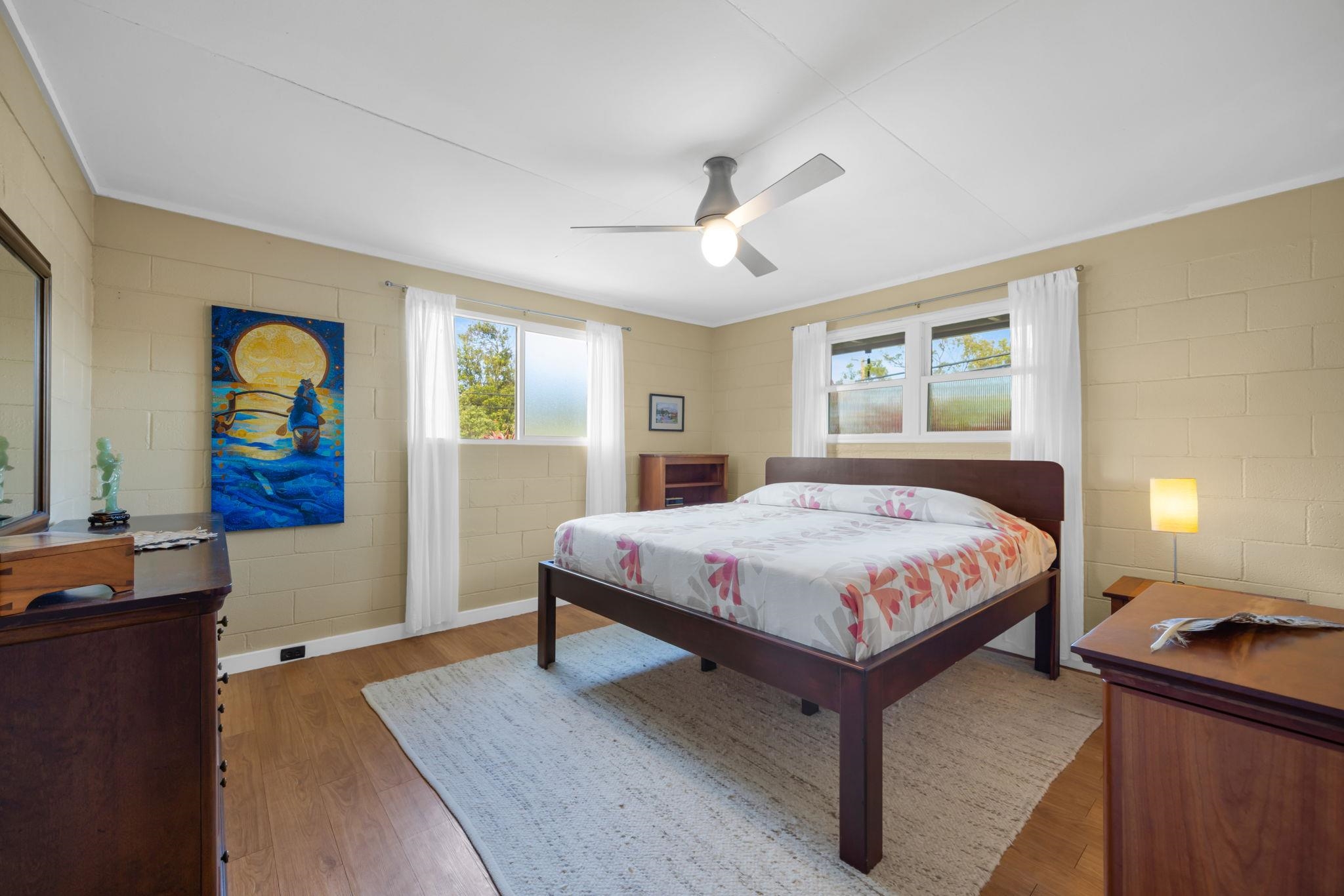 1199 Freitas Place Makawao, HI 96768 - Photo 16 of 49 a bedroom with a bed and a chandelier