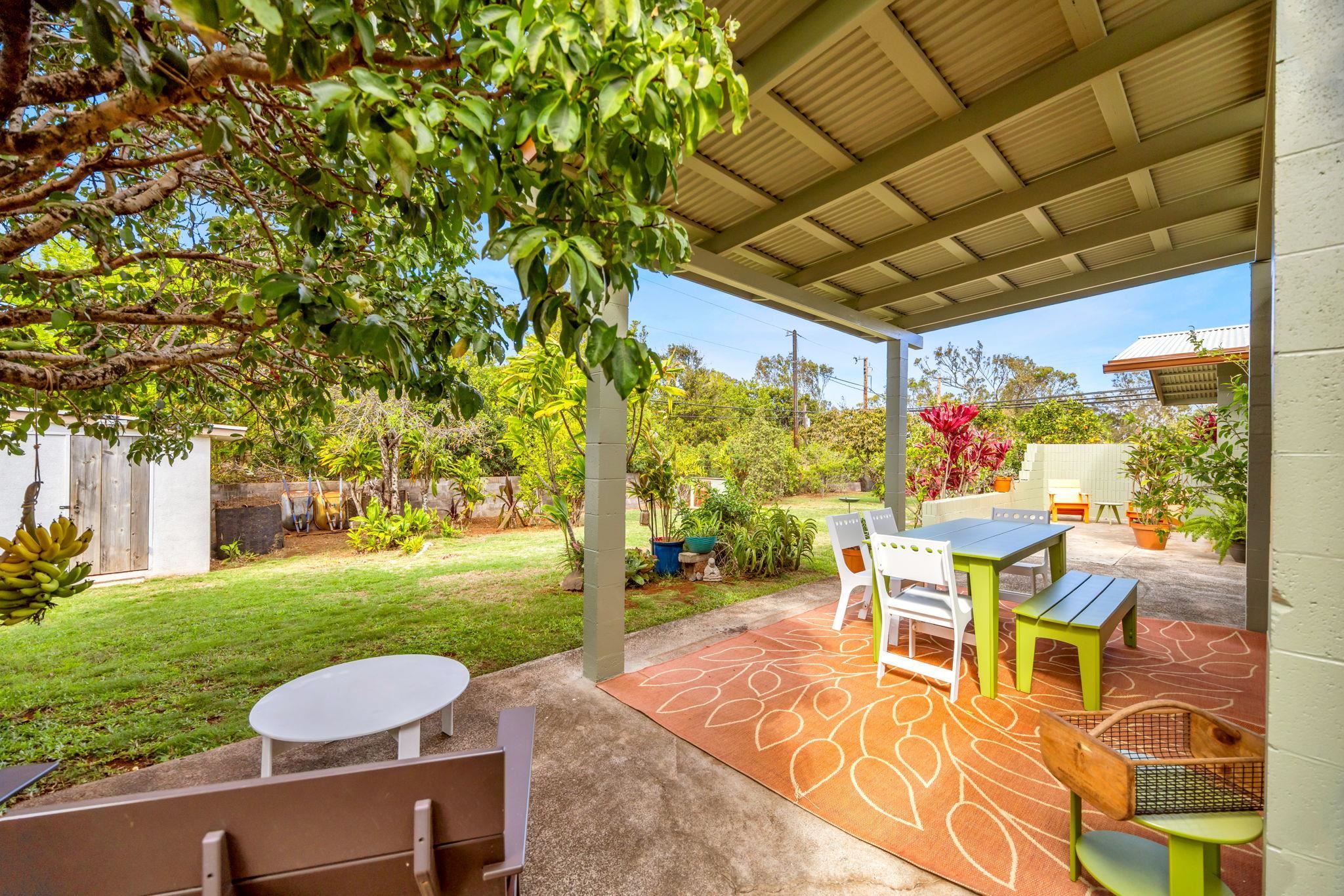 1199 Freitas Place Makawao, HI 96768 - Photo 2 of 49 a view of a patio with a table and chairs under an umbrella