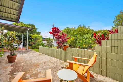 a view of an chairs and table in the patio