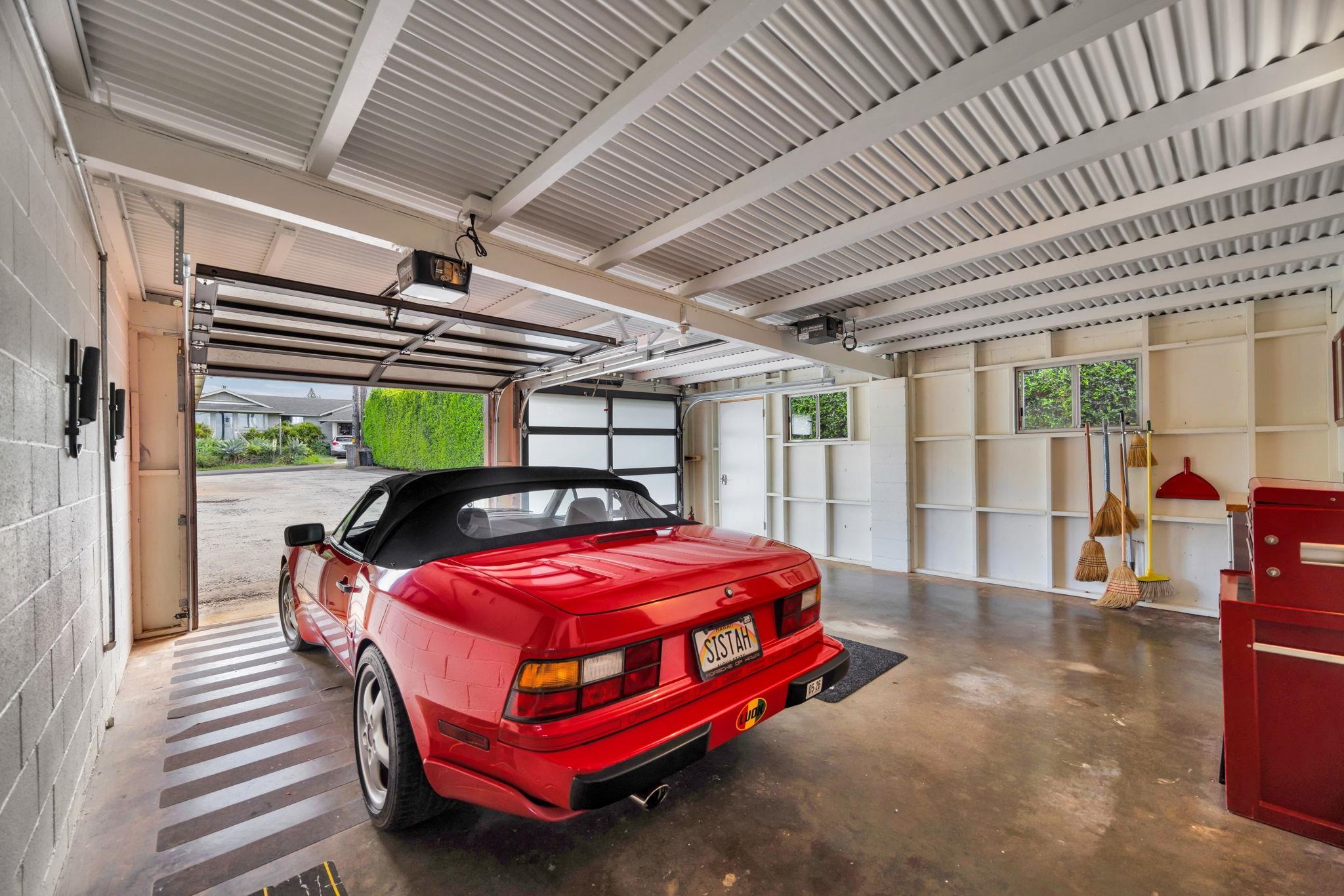 1199 Freitas Place Makawao, HI 96768 - Photo 46 of 49 a bedroom with a bed and large windows