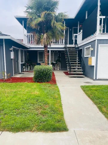 a front view of a house with a yard