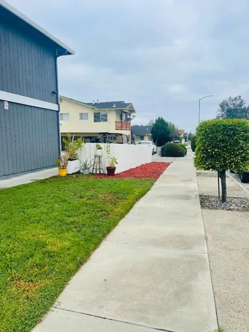 a view of a backyard with a sitting area