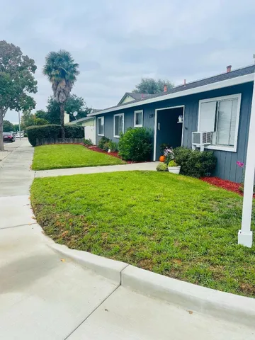 a view of a house with a garden