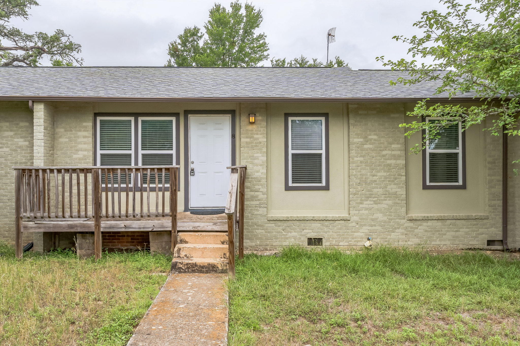 5216 McCarty Lane, Unit 8 Austin, TX 78749 - Photo 1 of 1 a view of a house with a deck and a yard