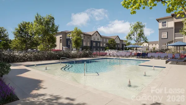 a swimming pool view with a outdoor seating space
