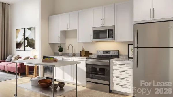 a kitchen with stainless steel appliances a stove a refrigerator and a sink