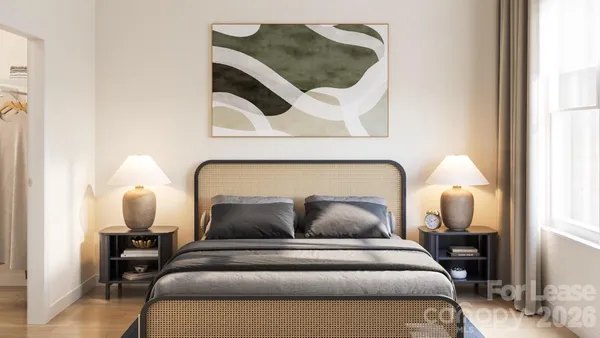 a bedroom with a bed and window