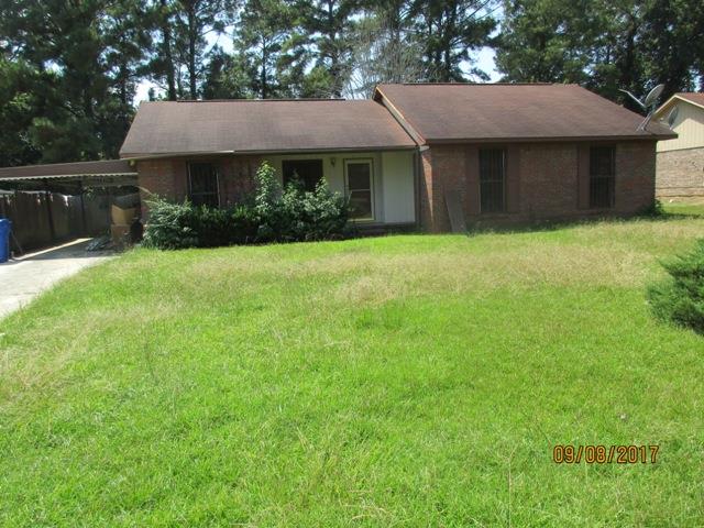 1742 Bunker Hill Road Columbus, GA 31907 - Photo 1 of 16 a front view of a house with a garden