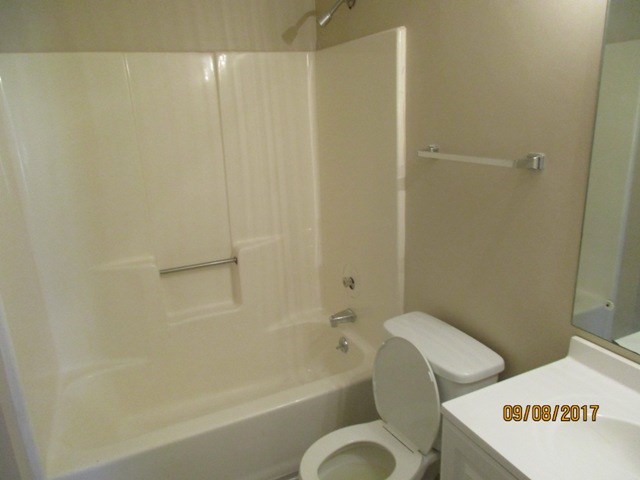 1742 Bunker Hill Road Columbus, GA 31907 - Photo 7 of 16 a bathroom with a toilet and a bathtub