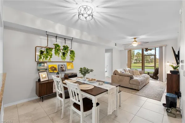 a view of a dining room with furniture window and outside view