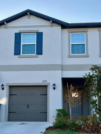 a front view of a house with garage