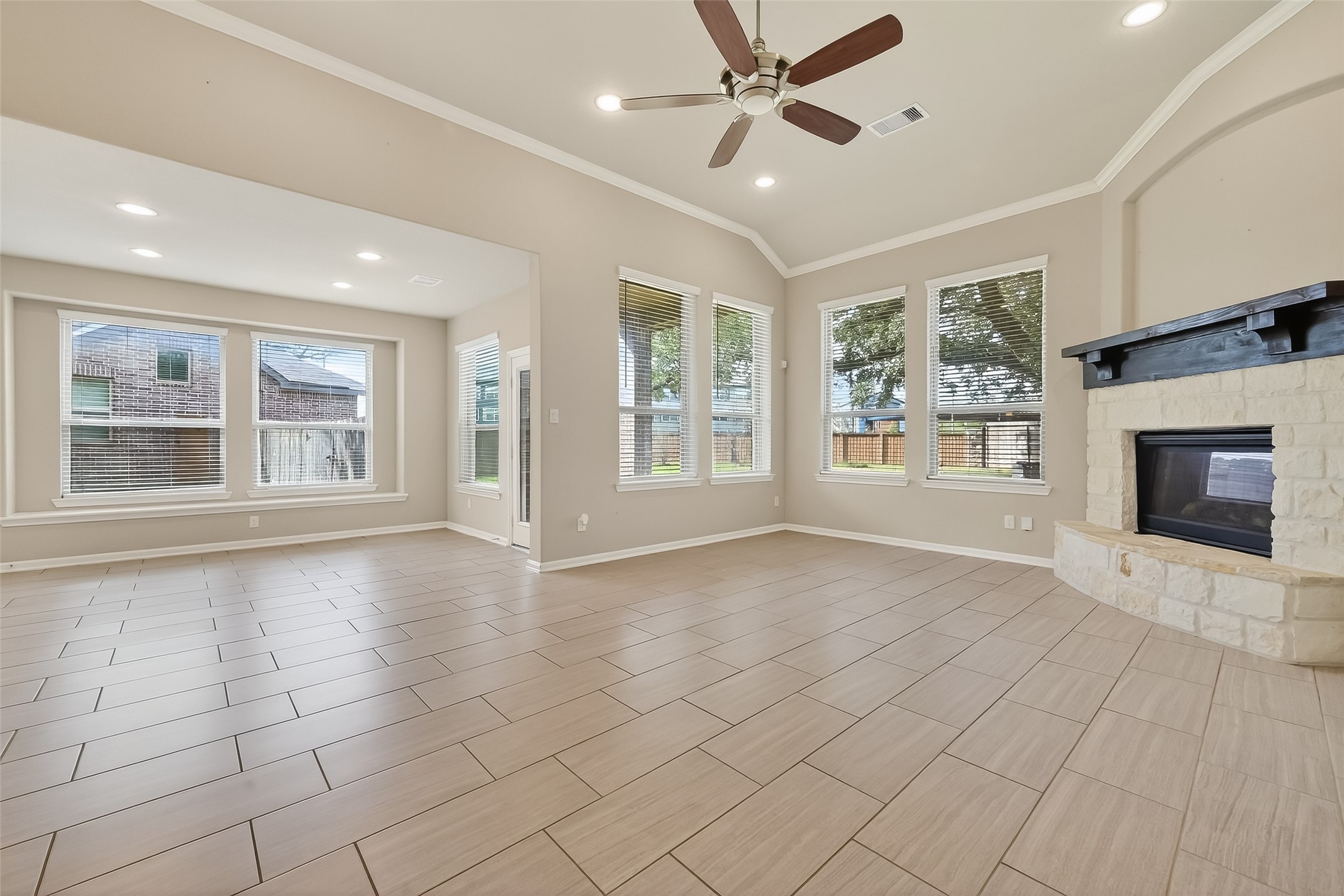 4718 Verbena Valley Way Spring, TX 77388 - Photo 11 of 24 a view of an empty room with a fireplace and windows