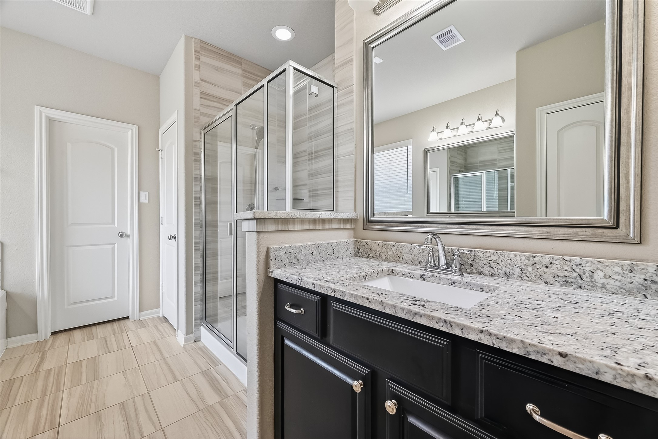 4718 Verbena Valley Way Spring, TX 77388 - Photo 21 of 24 a bathroom with a granite countertop sink and a mirror