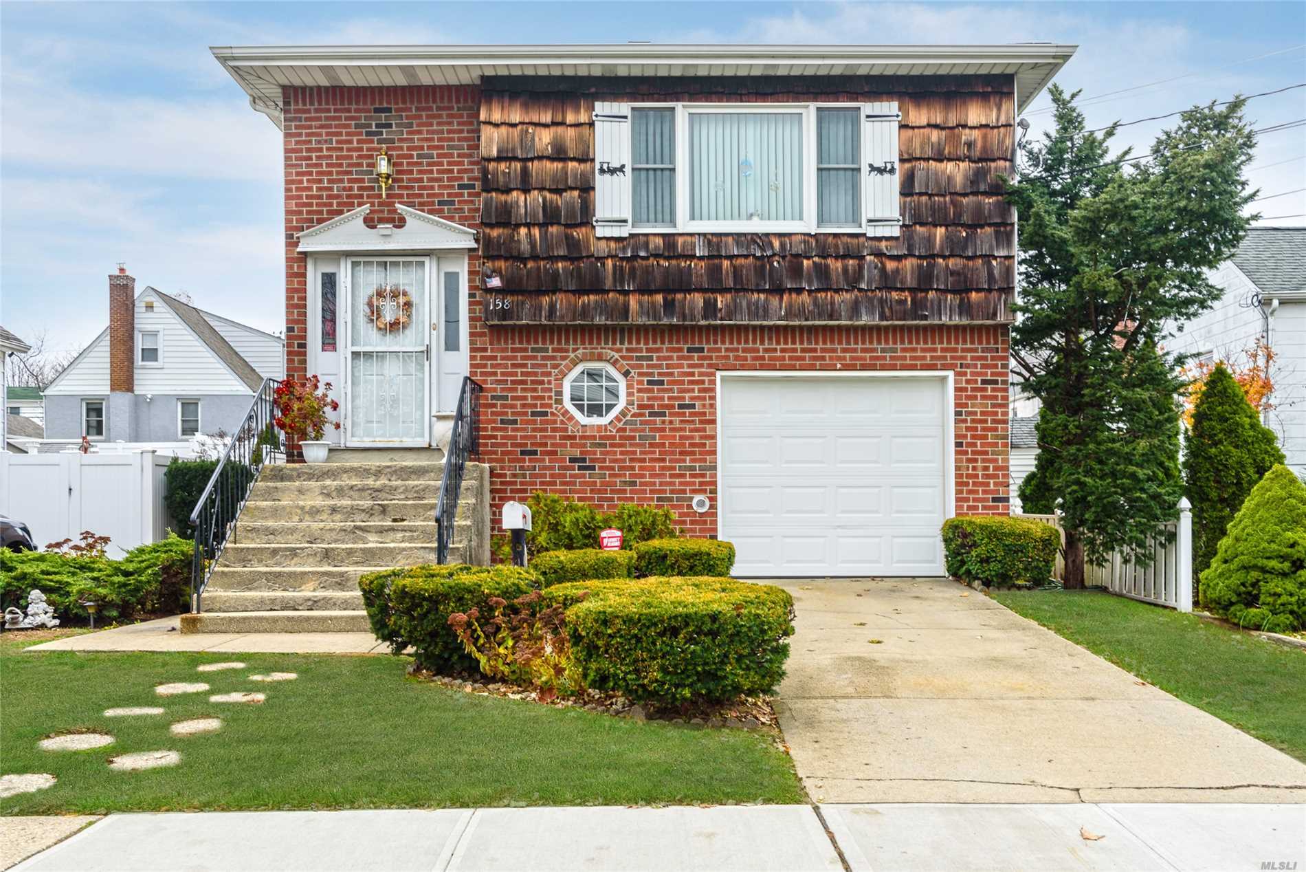 158 Ormonde Boulevard Valley Stream, NY 11580 - Photo 1 of 1 a front view of a house with a yard
