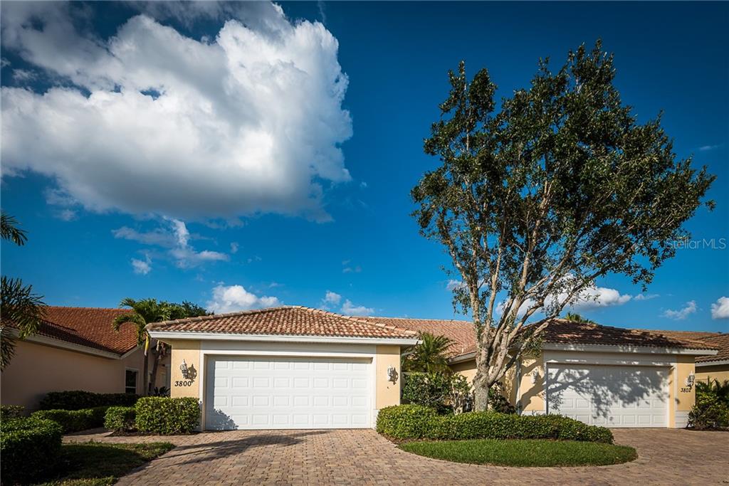 3800 Tripoli Boulevard, Unit 35 Punta Gorda, FL 33950 - Photo 1 of 44 a view of a house with a yard and potted plants