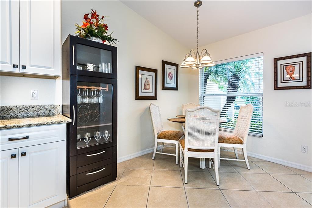 3800 Tripoli Boulevard, Unit 35 Punta Gorda, FL 33950 - Photo 15 of 44 a dining room with furniture and window