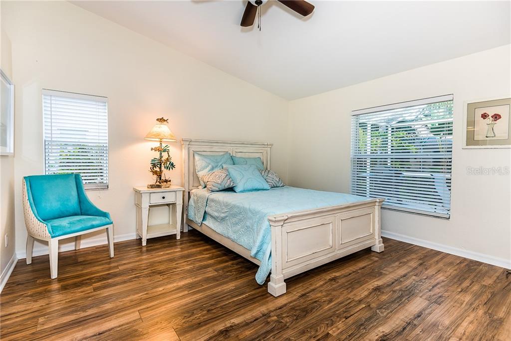 3800 Tripoli Boulevard, Unit 35 Punta Gorda, FL 33950 - Photo 26 of 44 a bedroom with a bed a couch and a window