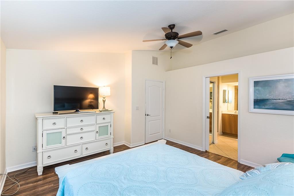 3800 Tripoli Boulevard, Unit 35 Punta Gorda, FL 33950 - Photo 28 of 44 a living room with furniture and flat screen tv